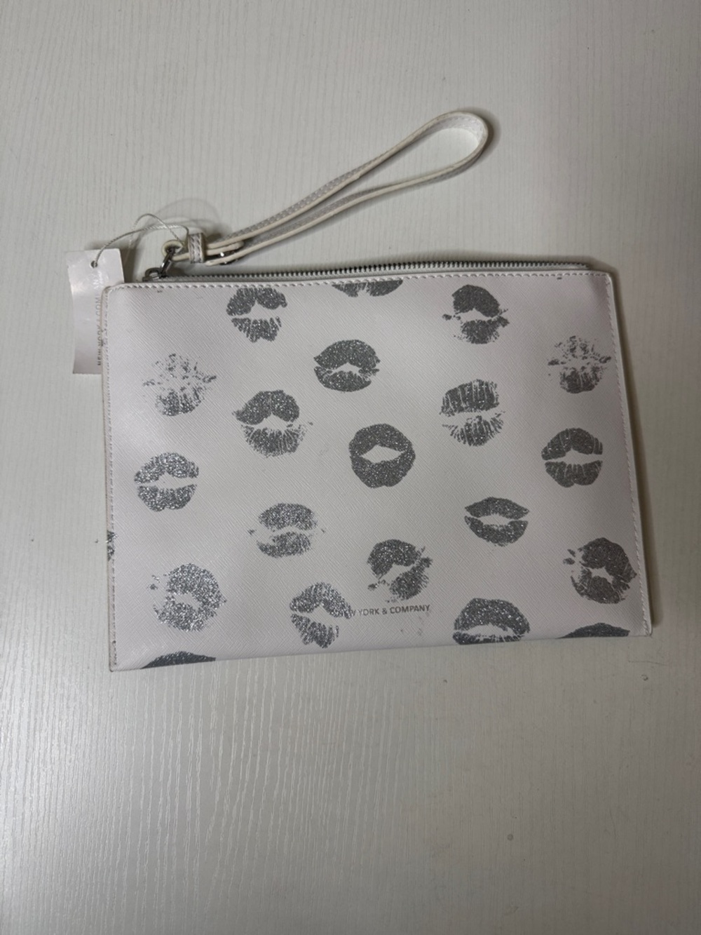 New York & Company White Wristlet with Silver Kiss Print